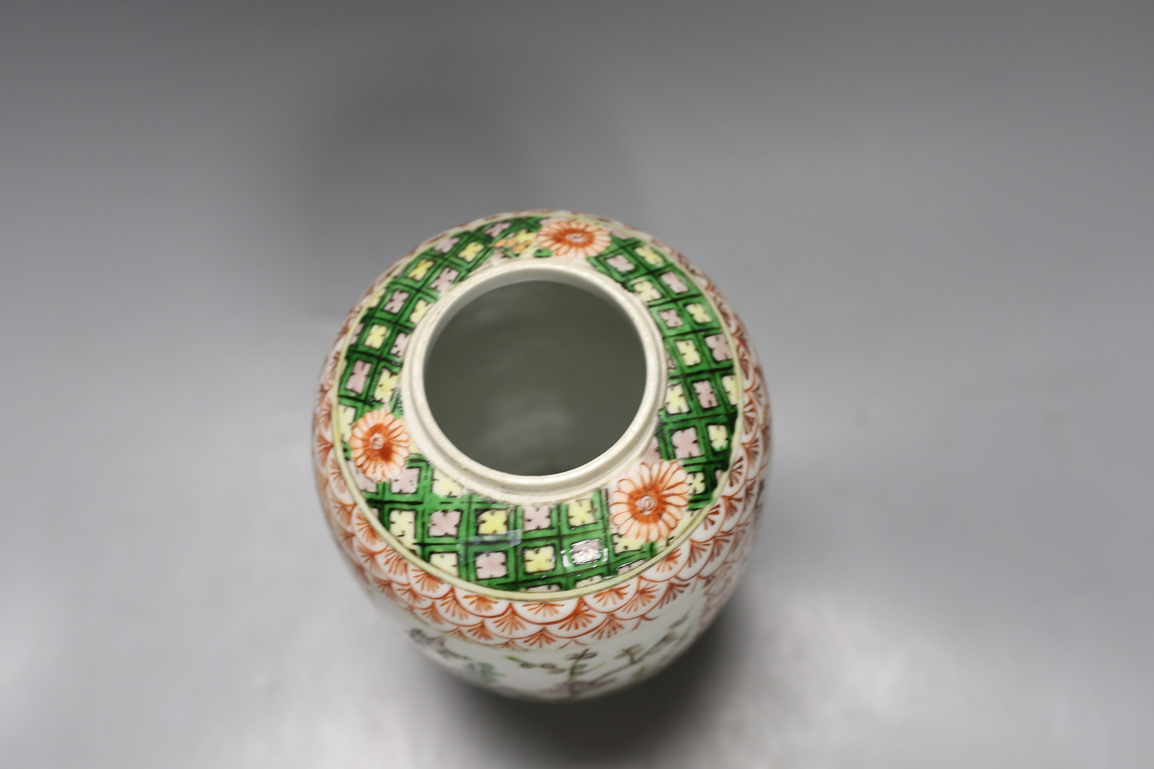 A Chinese famille verte ovoid jar, late 19th century, 19.5cm tall